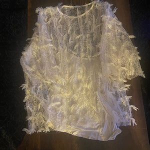 Cream colored shirt.